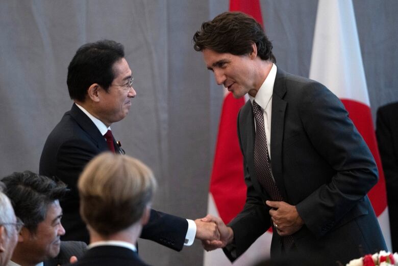 Prime Minister Justin Trudeau shakes hands with Japanese Prime Minister Kishida Fumio at a luncheon on Thursday, January 12, 2023 in Ottawa.