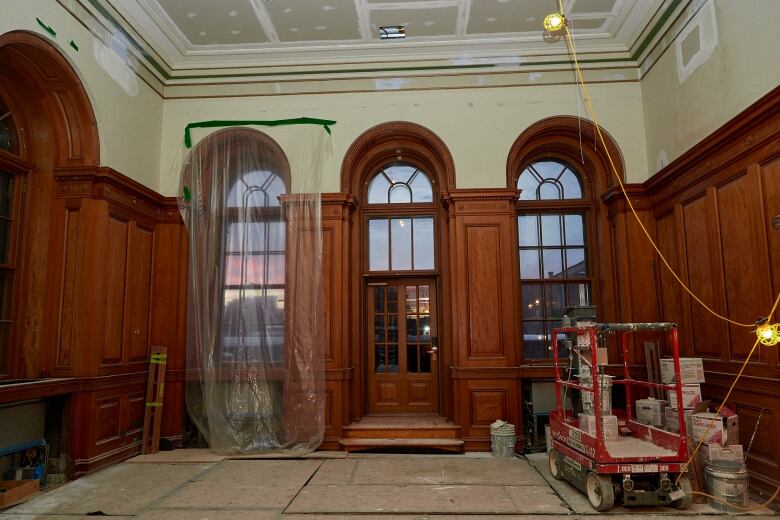 Wood panelling around arch windows