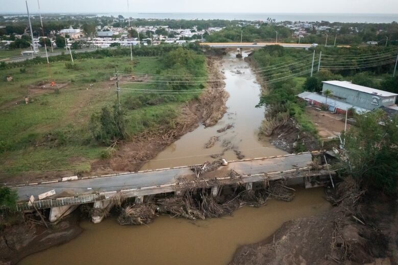 A view of a bridge in Villa Esperanza, Puerto Rico, damaged by flooding in the wake of last September's Hurricane Fiona.