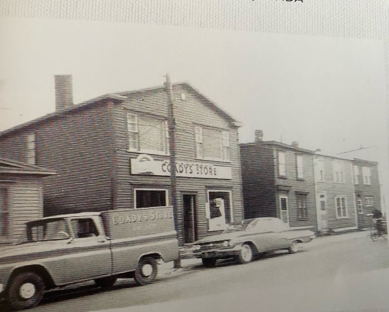 A black and white photograph of a store with a sign that reads Coadys Store.