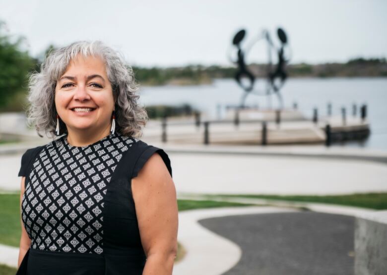 Smiling woman in a park.