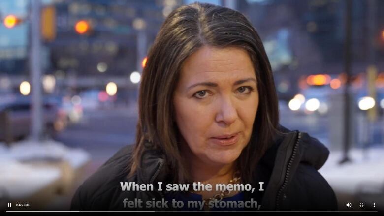 A freeze frame of a video in which Alberta Premier Danielle Smith speaks about a federal memo on 