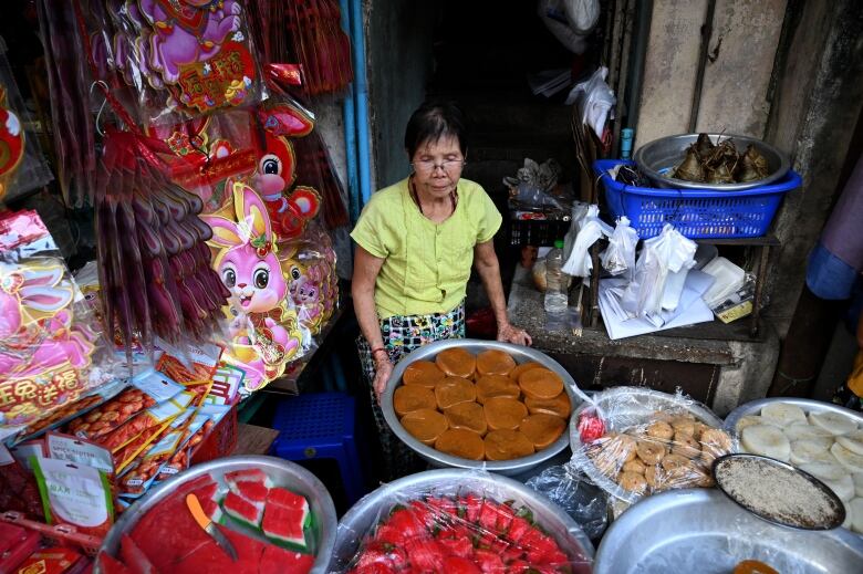 A vendor sells traditional snacks in Yangon's Chinatown in Myanmar ahead of the Lunar New Year.