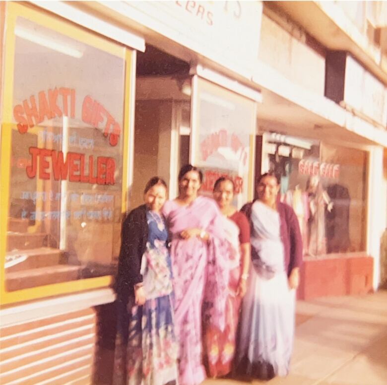 Balu Thakor's family members stand in front of his store, which was under a different name in the '70s.