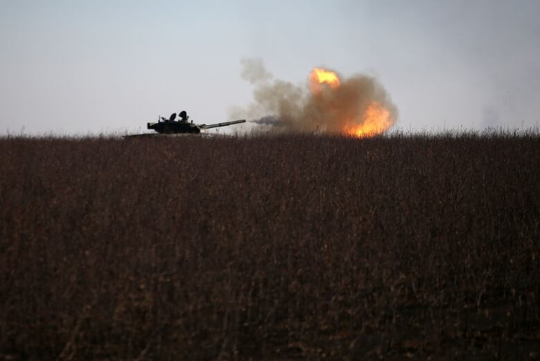 A Ukrainian tank fires toward a Russian position near the Ukrainian town of Bakhmut.