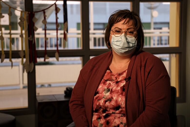 Tara Wren sits in a chair inside Edmonton's Stollery Children's Hospital.