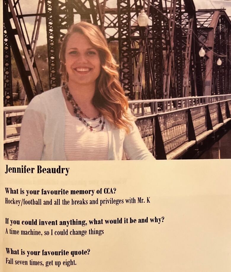 A photograph taken of a yearbook page. There is a teen smiling in front of a bridge. Beneath the photo of her is a question and answer section. 