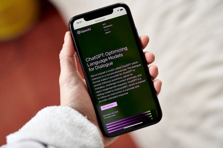 The ChatGPT website is seen on a smartphone. 