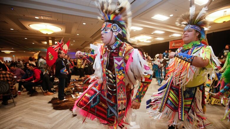 The Grand Entry makes its way into a signing ceremony of the Peguis First Nation Honouring our Children, Families and Nation Act Coordination Agreement in Winnipeg, Tuesday, January 31, 2023.