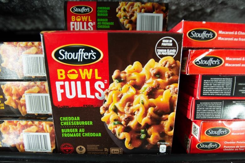 Several red and black boxes of Stouffer's 'Cheddar Cheeseburger' product.