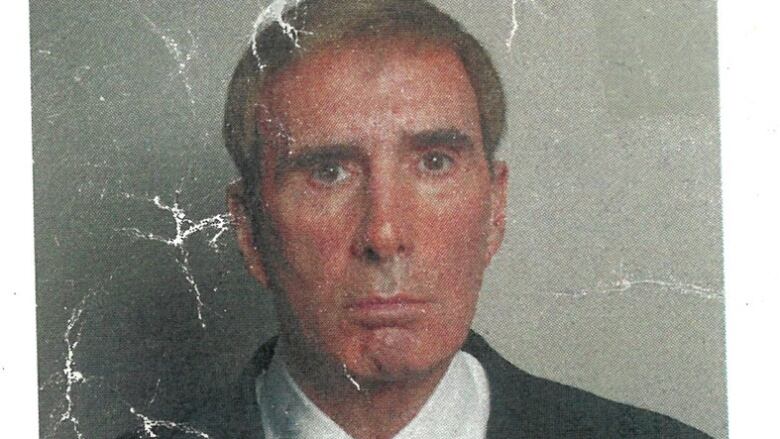  Wrinkled damaged photo of businessman.