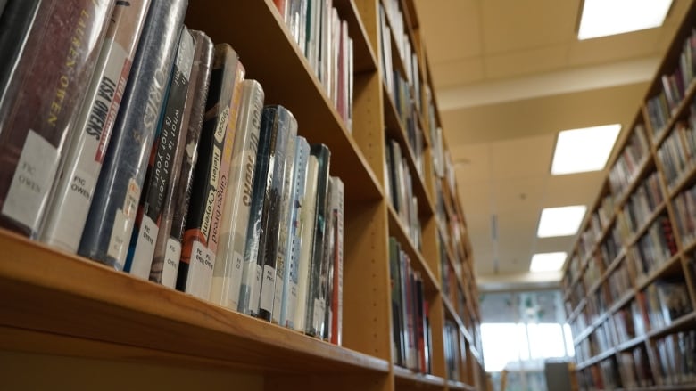 A photo of stacks of books in a library in Ottawa.