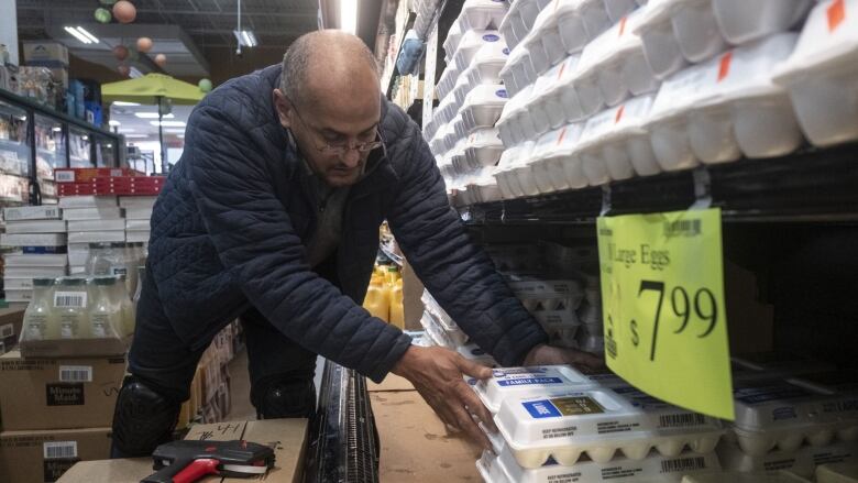 A worker arranges eggs for sale at a store in Detroit Michigan last month.