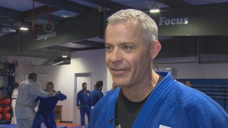 A Judoka faces the camera.