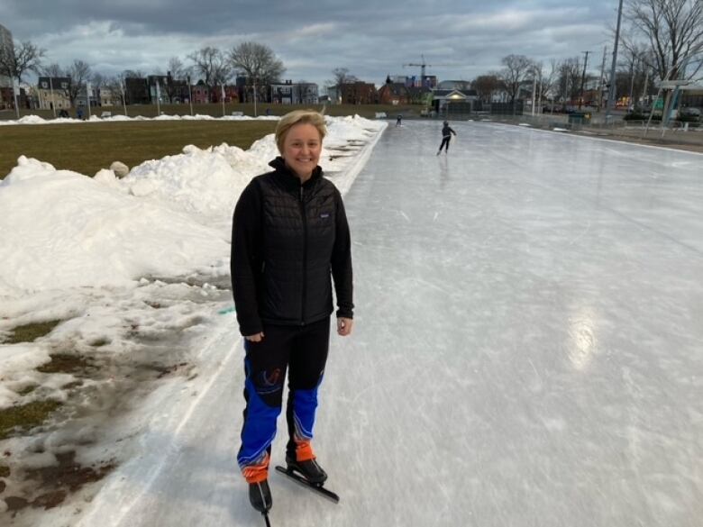 Two speed skaters at the start of a race on the Halifax Oval in winter. 