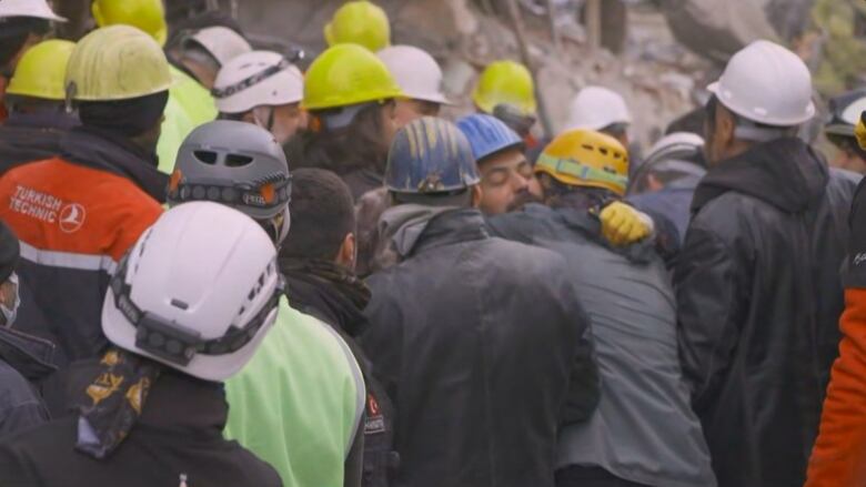 A group of men in hard hats.