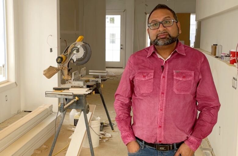 Shameer Gaidhar stands inside one of his inner city homes that is under construction. He's the chair of the Calgary Inner City Builders Association.