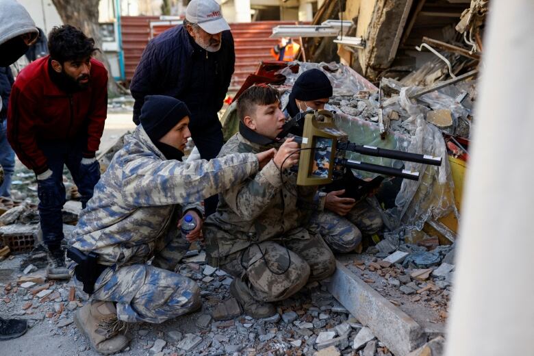 A rescue team works at a collapsed building in Turkey.