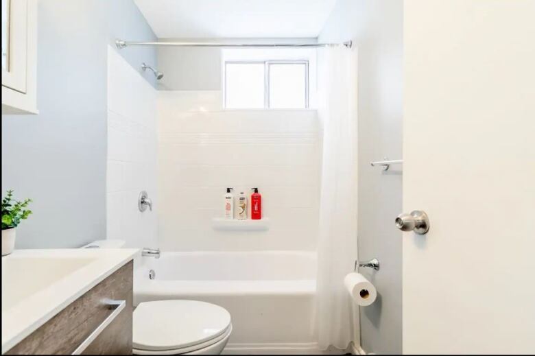 Bathroom with sink, toilet and shower that appear to be newly renovated.