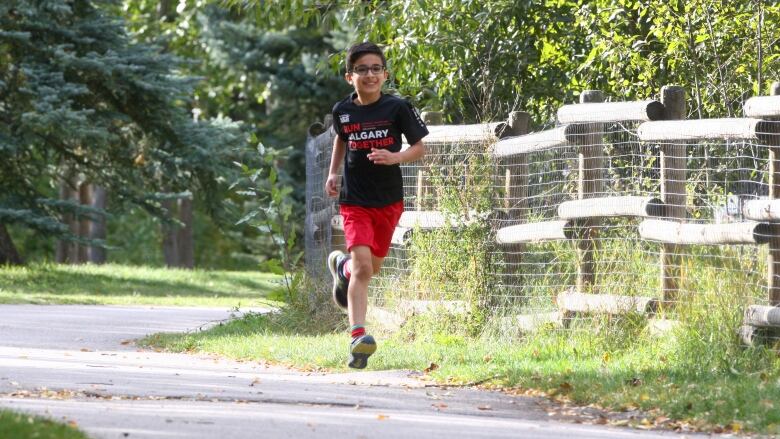 A young boy is pictured running.