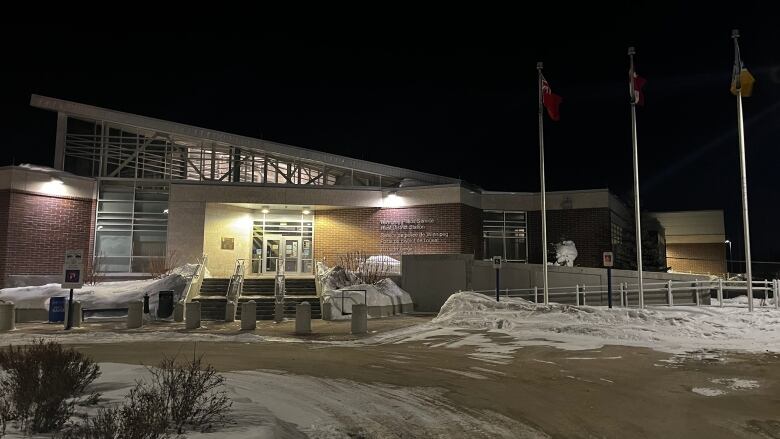 Night shot of west district police station.