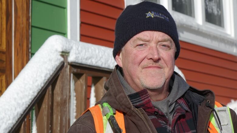 Dan Hickey stands in front of his snow covered home in downtown St. John's.