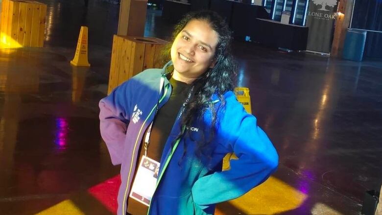 student volunteer smiling in Charlottetown Port venue at Canada Games