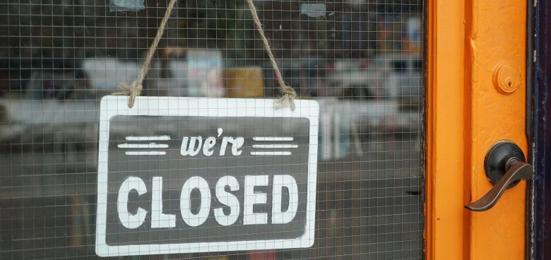 Door with signs that say books and closed