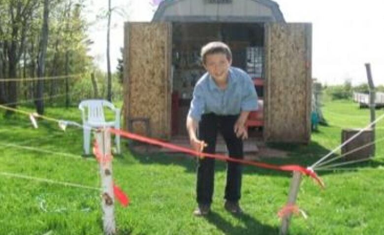 person cutting ribbon 