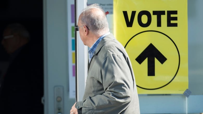 A man arrives to cast his ballot at a polling station on federal election day in Shawinigan, Que.