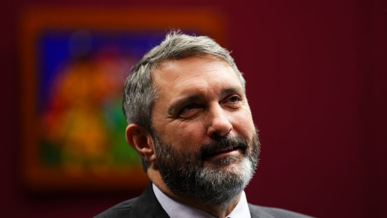 Close-up of bearded, smiling man.