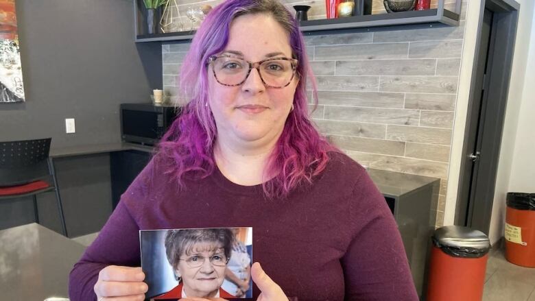 Woman holding photograph