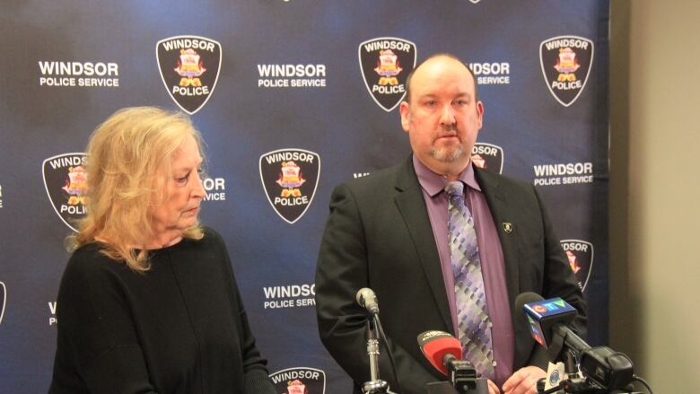 Bonnie Bednarik and Sgt. Rob Durling of the Windsor Police Service speak to reporters after Bednarik helped police arrest the men who tried to scam her.