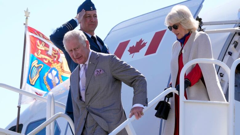 Charles and Camilla are seen disembarking their plane in Yellowknife.