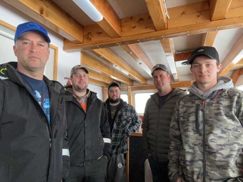 A fishing crew is shown in a photo.