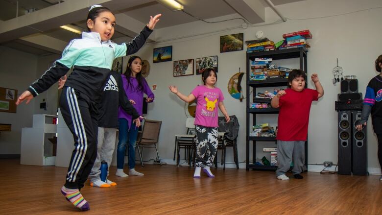 Kids dance to a Zumba workout.