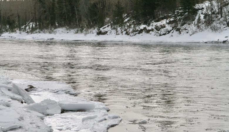 An icy Bow River flows through the town of Cochrane.