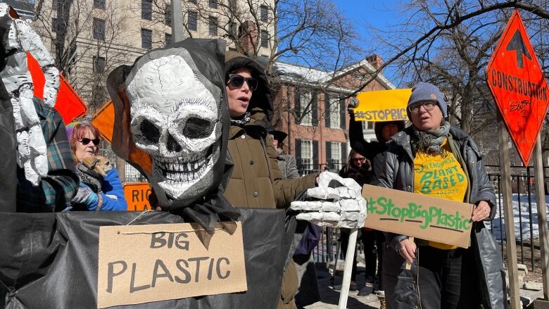 Protesters gather outside the federal court house in Toronto. 