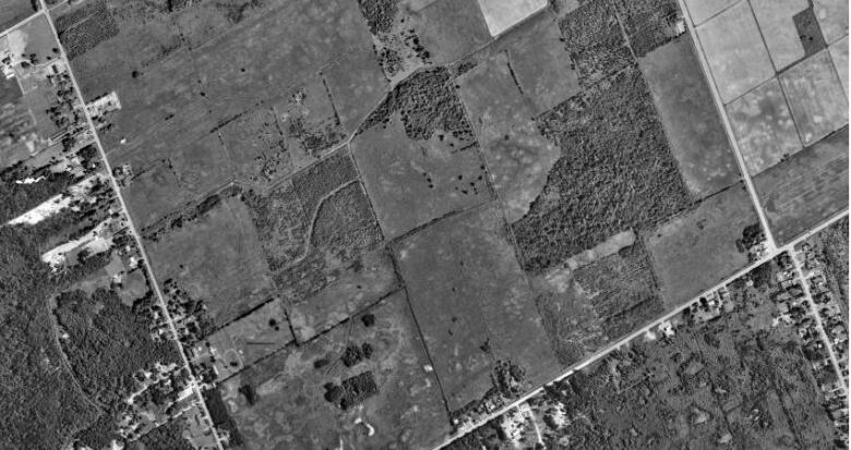 A satellite image that shows land north of Piperville between Ramsayville and Anderson Roads in 1991.