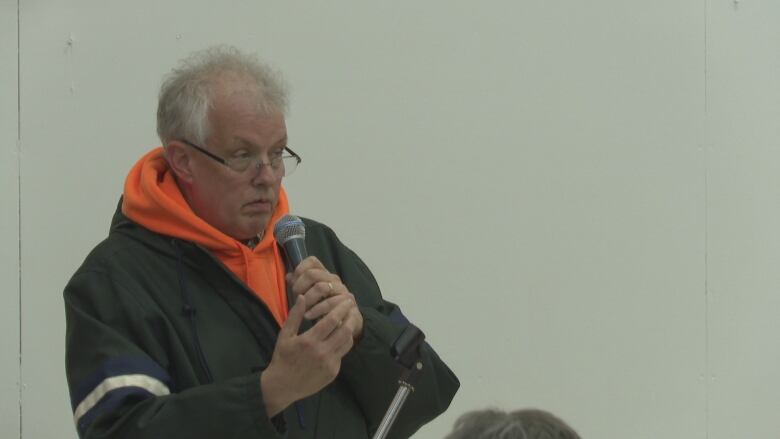 NDP candidate Joe Byrne speaks at a public meeting on a supervised injection site in Charlottetown.