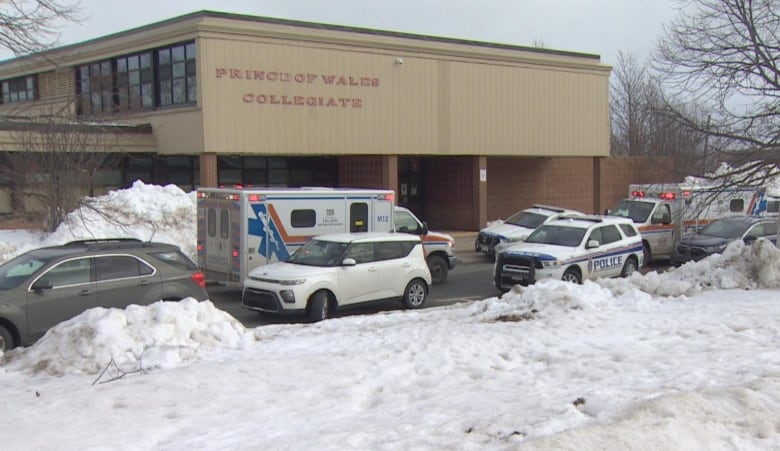 School exterior with first responder vehilces outside. 