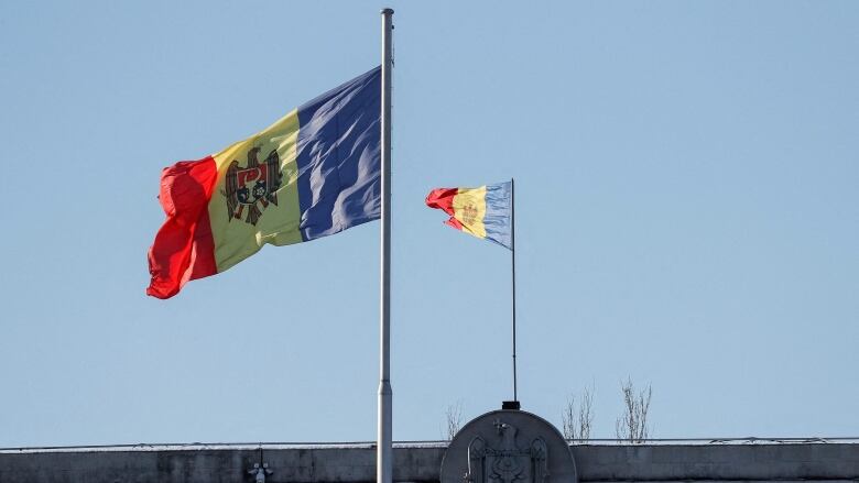 A January 2019 file photo shows Moldovan national flags flying in central Chisinau.