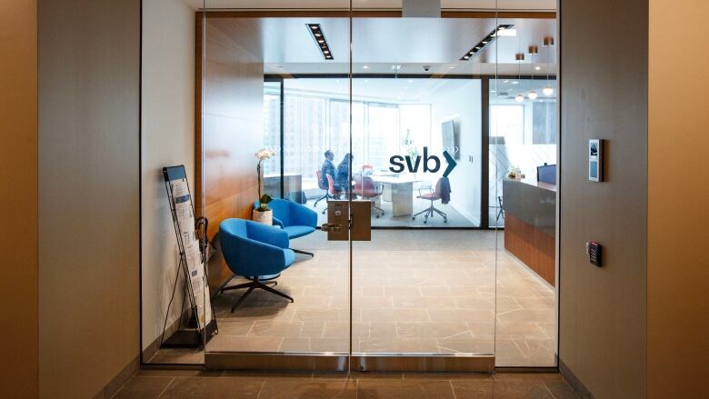 People sit in a meeting room in the offices of Silicon Valley Bank in Toronto