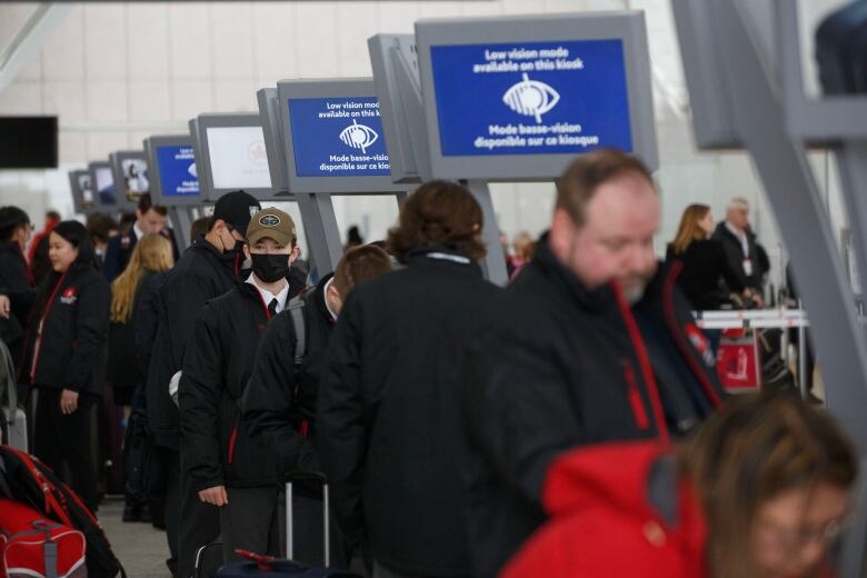 A photograph of Travellers waiting in a long line at Toronto Pearson International Airport for March break 2023.