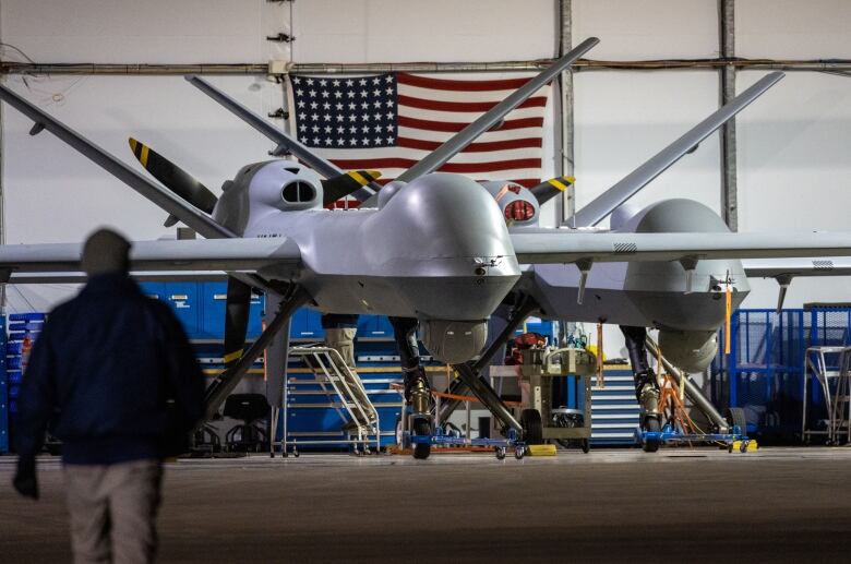 A drone is seen in a hangar.