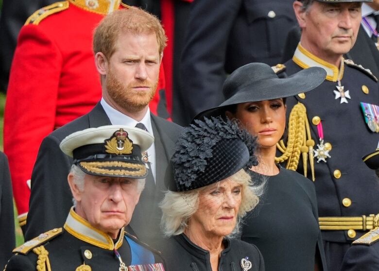 King Charles III, from bottom left, Camilla, the Queen Consort, Meghan, Duchess of Sussex and Prince Harry are pictured.