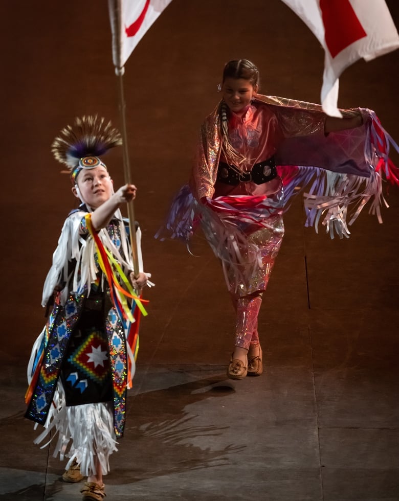 Two dancers on a stage.