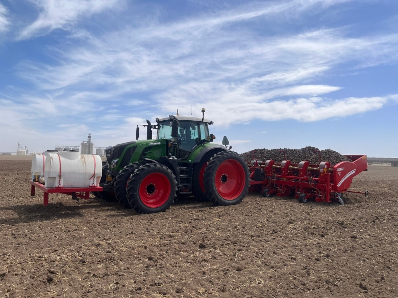 A tractor sits on a field.