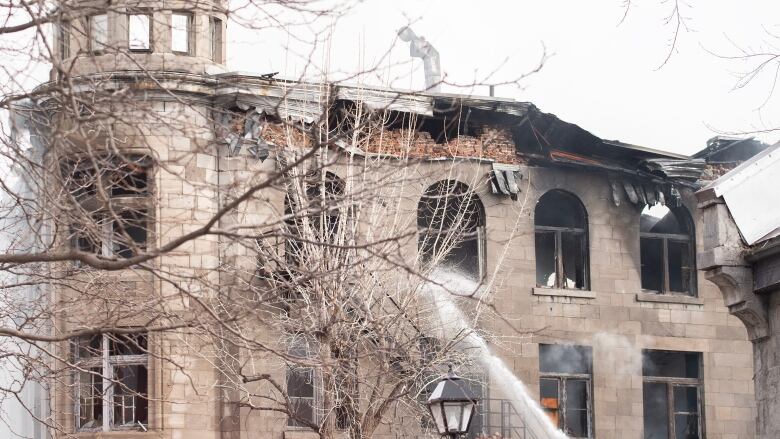 Water pouring into a building.