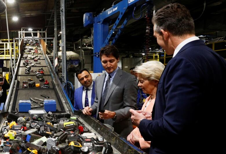 Prime Minister Justin Trudeau and European Commission President Ursula von der Leyen, with Li-Cycle President and CEO Ajay Kochnar and Executive Chairman Tim Johnston, tour the lithium-ion battery recycling firm Li-Cycle in Kingston, Ontario on March 7, 2023.